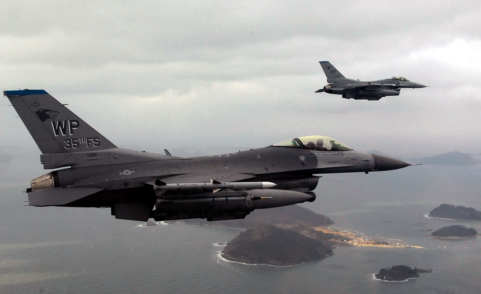F-16 Fighting Falcons fly on a training mission Jan. 30 over the South Korean peninsula. Pilots assigned to the 35th Fighter Squadron from Kunsan Air Base, South Korea, use training missions to simulate actual conditions they may face in combat and keep their warfighting skills honed. (U.S. Air Force photo/Tech. Sgt Quinton T. Burris)

