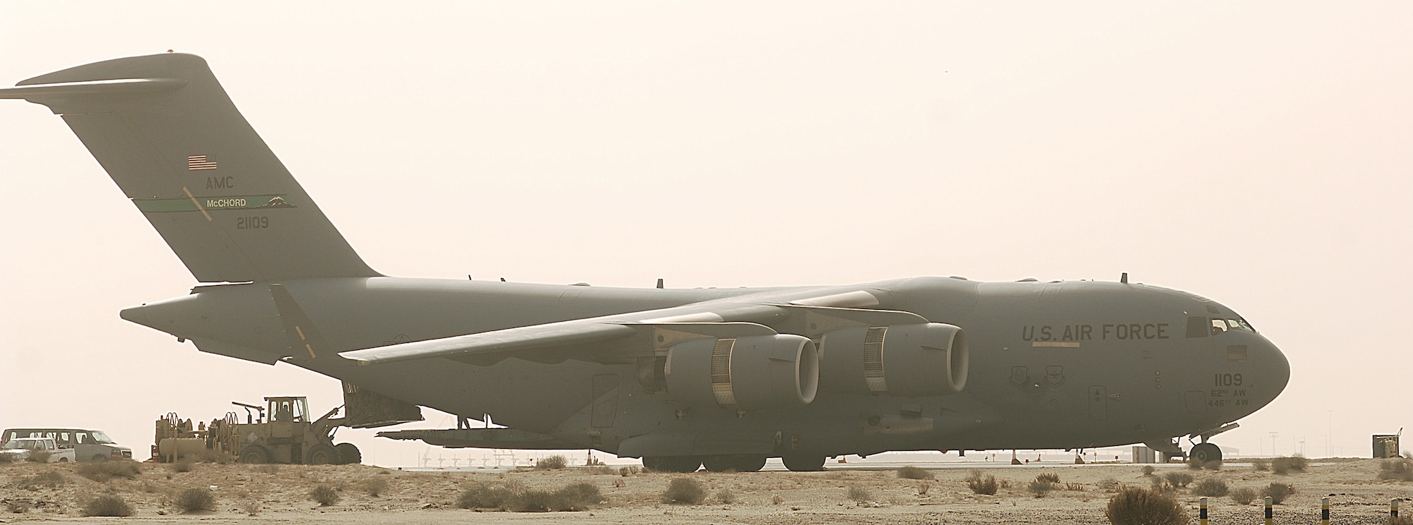 SOTHWEST ASIA -- A C-17 Globemaster III, from McChord Air Force Base, Wash., has its cargo unloaded at an air base in the Persian Gulf Region. The aircraft is moving troops throughout Iraq. (U.S. Air Force photo/ Senior Airman Patrick Dixon)