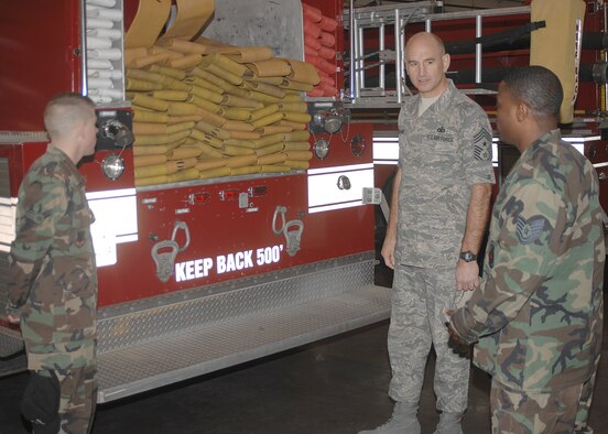 SEYMOUR JOHNSON AIR FORCE BASE, N.C. - Chief Master Sergeant Steve Sullens, Air Combat Command command chief master sergeant, talks with Airman 1st Class Garrett Heaton and Tech. Sgt. Alexander Jones, both 4th Civil Engineer Squadron, about the new fire station during his visit here Jan. 26. (U.S. Air Force photo by Senior Airman Chad Trujillo)
