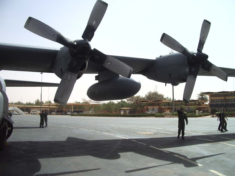 Staff Sgt. Ed Lewis, 37th Airlift Squadron flight engineer, inspects the C-130 at a forward location before the mission.