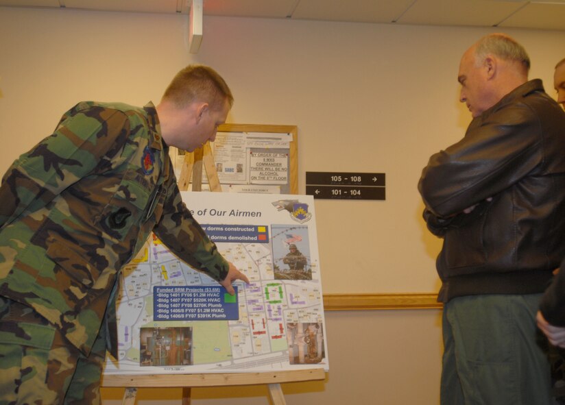KUNSAN AIR BASE, South Korea --  Maj. Aaron Altwies, from the 8th Civil Engineer Squadron, discusses plans for new dormitories with Gen. Howie Chandler, Pacific Air Forces commander, during his visit here Jan. 31.  This is General Chandler's first visit to Kunsan since becoming the PACAF commander.  (U.S. Air Force photo/Staff Sgt. Darcie Ibidapo)