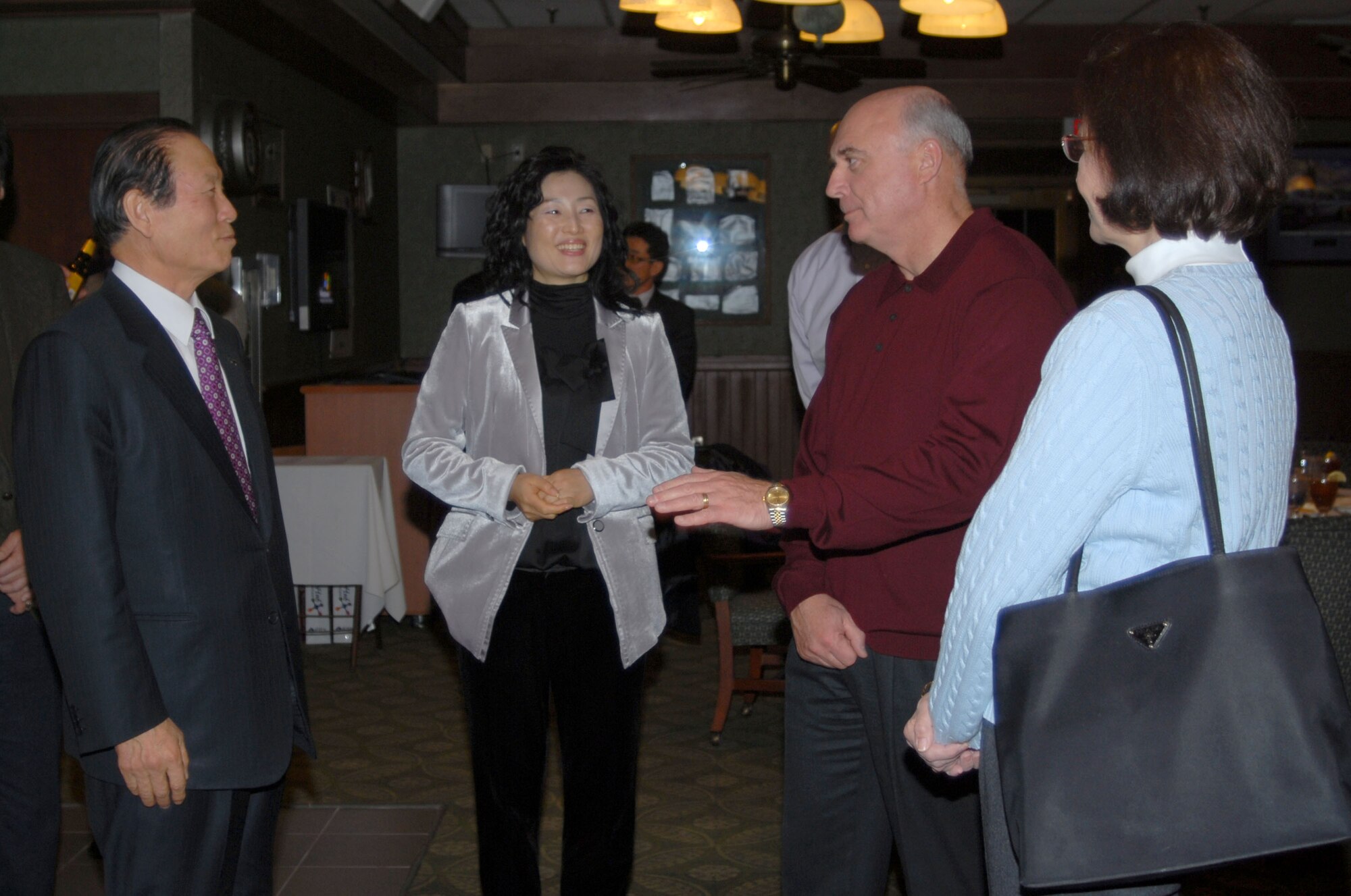KUNSAN AIR BASE, South Korea -- Gen. Howie Chandler, Pacific Air Forces commander, and his wife Eva Marie, speak with Dong Shin Moon, mayor of Gunsan City, during their visit here, Jan. 30.  This is General Chandler's first visit to Kunsan since becoming the PACAF commander.  (U.S. Air Force photo/Staff Sgt. Darcie Ibidapo)