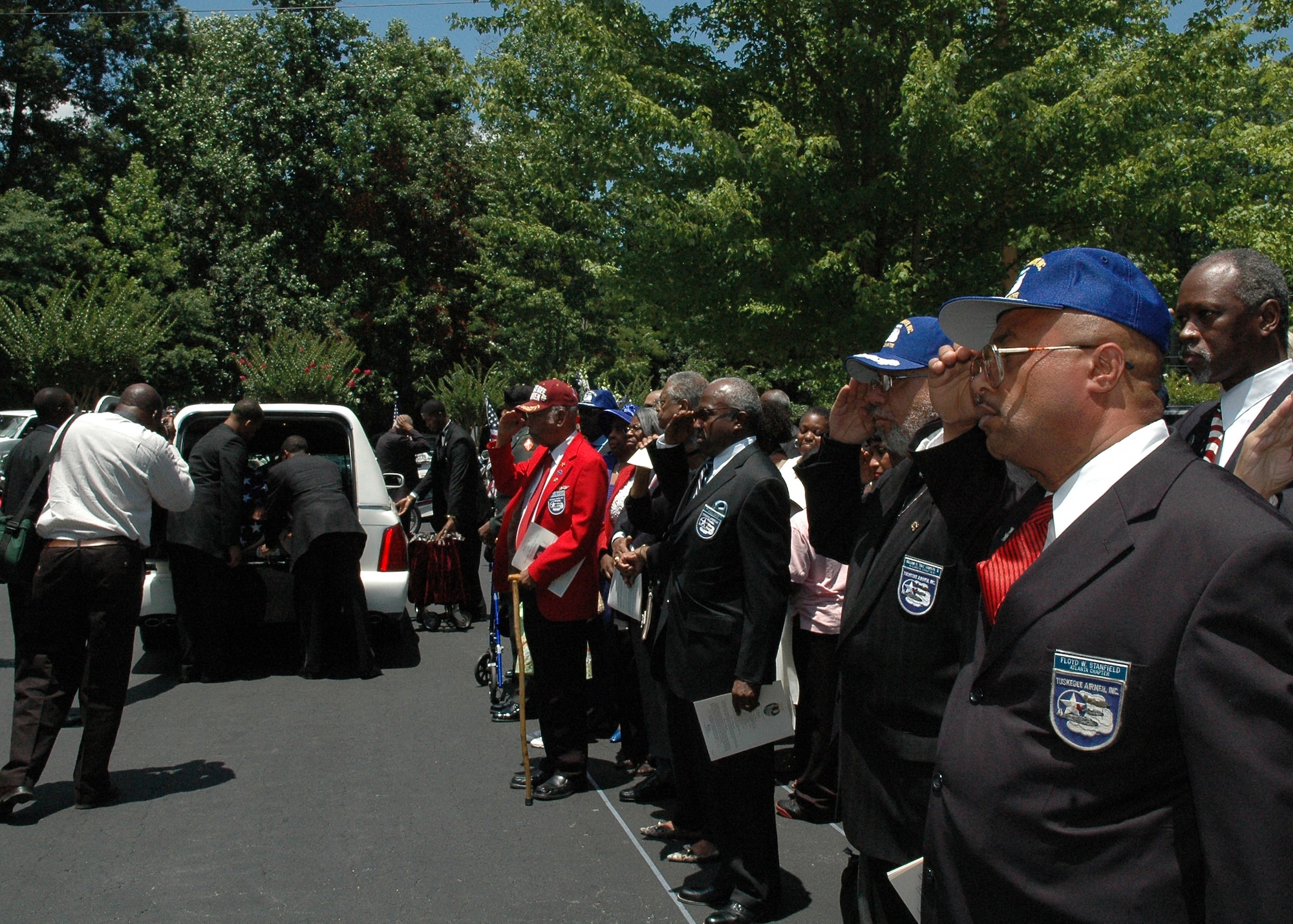 7/1/2008--Master Sgt. Floyd Stanfield, 94th Maintenance Squadron air reserve technician and aerospace ground equipment supervisor (far right) at Dobbins Air Reserve Base and president of the Atlanta Chapter Tuskegee Airmen, renders a last salute to the memory of retired Air Force Lt. Col. Charles Dryden during the post-funeral service procession at Cascade United Methodist Church in Atlanta.  Colonel Dryden, one of the last Tuskegee Airman World War II fighter pilots in the Atlanta area, passed away on Tuesday, June 29. He retired from the Air Force in 1962 after 21 years of service.  Colonel Dryden frequently spoke at Dobbins and throughout the country on the experiences and contributions of the Tuskegee Airmen during their military service.  (U.S. Air Force photo/Master Sgt. Stan Coleman)
