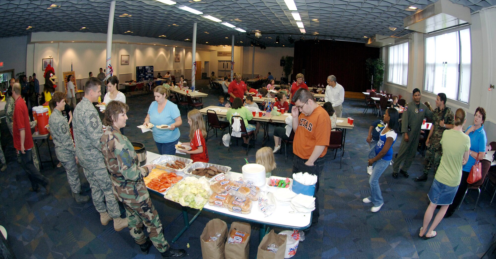FAIRCHILD AIR FORCE BASE, Wash. – Family members with deployed spouses enjoy a summer meal that included burgers, hotdogs, potato salad, beans, cookies and cake at the Deel Community Center June 26. The event brings family members together whose spouses are deployed throughout the world. (U.S. Air Force photo / Staff Sgt. JT May III)



