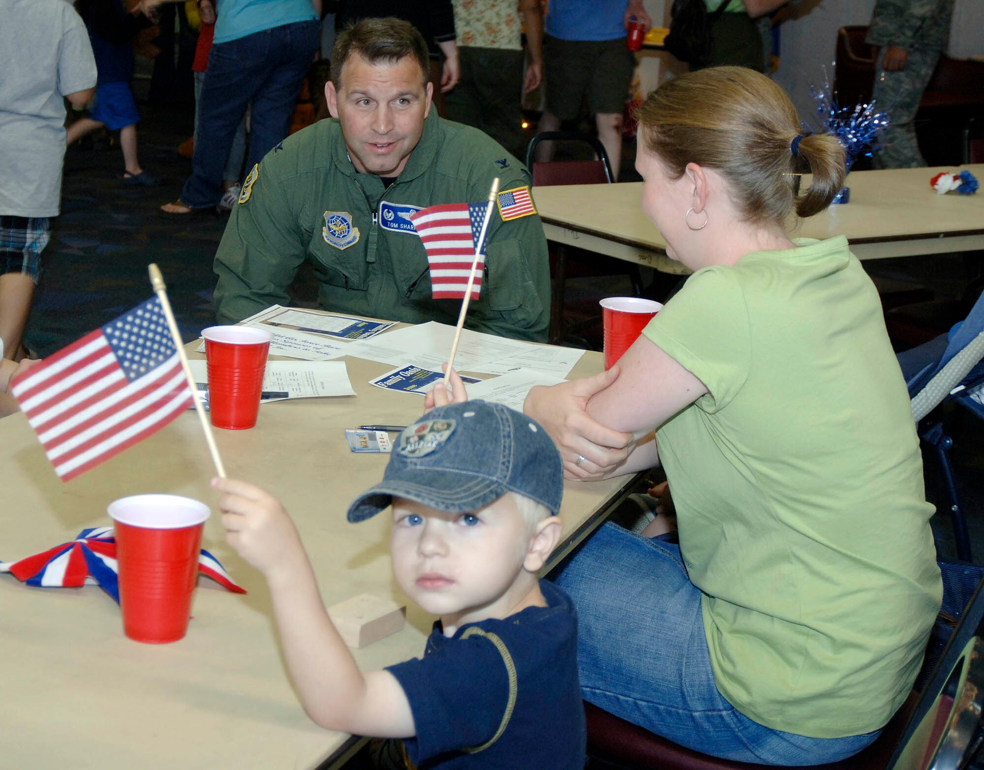 FAIRCHILD AIR FORCE BASE, Wash. – Col. Thomas Sharpy, 92nd Air Refueling Wing commander, visits with Mandy Street and her son, Joel, 3, at the Deployed Spouses Dinner at the Deel Community Center June 26. The night included various activities, such as games, give-aways and a bouncer for kids. “This event gives spouses a chance to interact with other families, fostering friendship in a time of need,” said Master Sgt Tracy Flax, 92nd Communication Squadron information services chief. (U.S. Air Force photo / Staff Sgt. JT May III)



