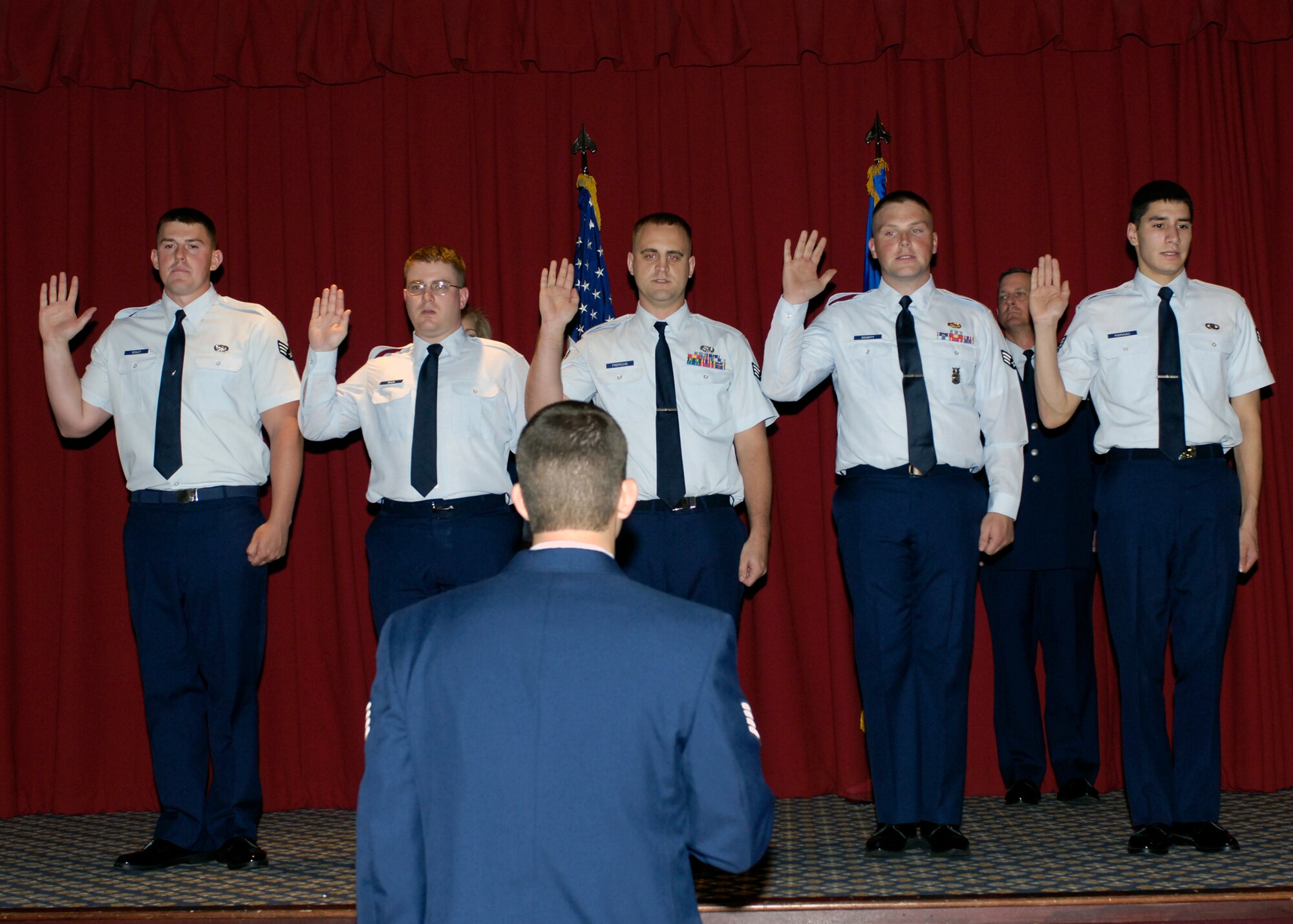 FAIRCHILD AIR FORCE BASE, Wash. -- Newly promoted staff sergeants recite the Non-Commissioned Officer Charge during the Wing Promotion Ceremony at Club Fairchild July 30. More than 30 Airmen were recognized at the ceremony. (U.S. Air Force photo / Airman 1st Class Melissa Barnett)
