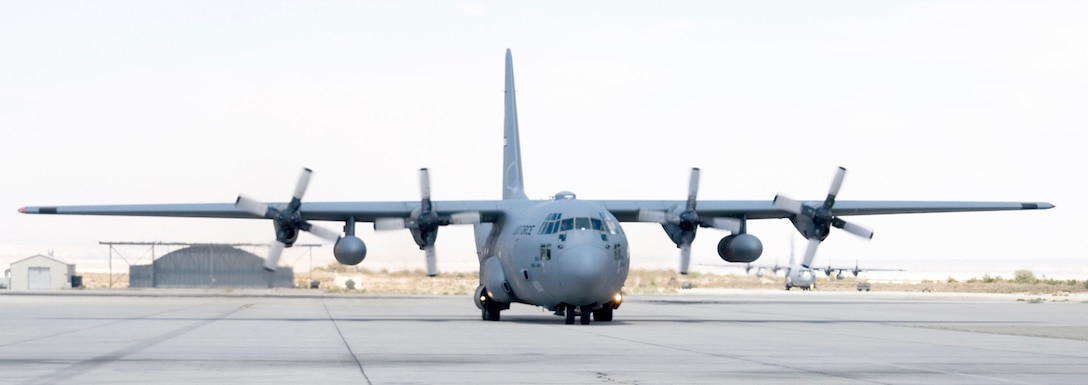 A C-130 Hercules taxis on an Edwards runway here June 16 after performing communication, navigation, radar and air data testing as part of the Avionics Modernization Program. The AMP upgrade includes replacement of 1960s era instruments with a modernized glass cockpit. Developmental testing of the C-130 AMP is scheduled to end in September 2009. (Air Force photo by Edward Cannon)