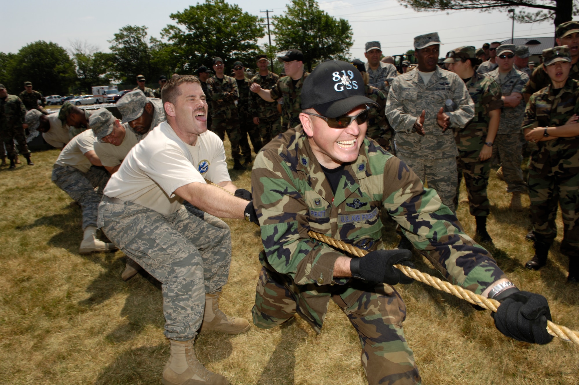 Lt. Col Michael Pratt, 819th Global Support Squadron commander, leads his troops in tug-of-war during the 621st Contingency Response Wing Combat Field Day June 27 here. The field day consisted of numerous events, including the ruck-sack relay, tent building and an obstacle course. (U.S. Air Force photo/Kenn Mann)
