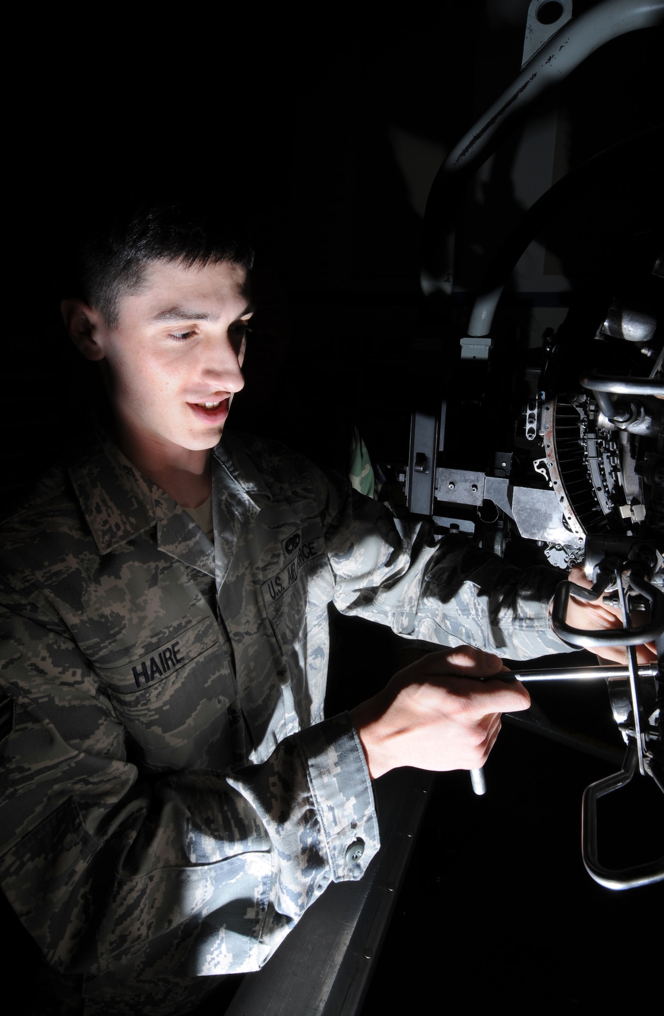 MOUNTAIN HOME AIR FORCE BASE, Idaho -- Airman 1st Class Justin Haire, 366th Component Maintenance Squadron aerospace propulsion apprentice, trains on an F15 aircraft engine at the 372nd Training Squadron detachment June 27.  The 372nd TRS, based out of the 982nd Training Group at Sheppard Air Force Base, Texas, teaches more than 50 different courses to seven maintenance career fields. As part of the Air Education and Training Command, the squadron's courses act as required steps in gaining five- or seven-levels certification and all are Community College of the Air Force accredited. (U.S. Air Force photo/ Airman 1st Class Stephany Miller)