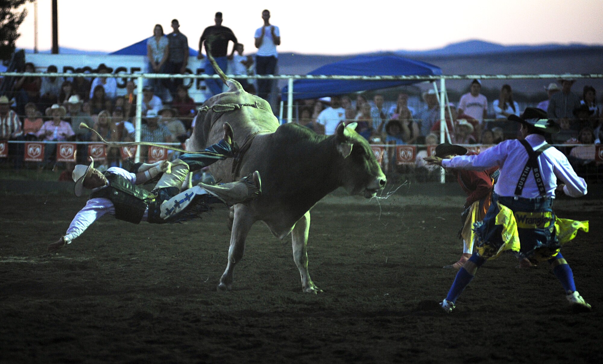 MOUNTAIN HOME AIR FORCE BASE, Idaho-- A bull rider from the Professional Rodeo Circuit gets bucked from the back of his bull during the third annual Daniel Dopps Memorial Rodeo at Optimist Park June 28 for the last few seconds of his ride. Daniel, a Gunfighter who passed away Aug. 7, 2005, died from injuries sustained Aug. 6, 2005, at a Professional Rodeo Cowboys Association event at the age of 19 while assigned to the 366th Civil Engineer Squadron. People from around the Mountain Home community attended this event to support Daniel's family and to enjoy a night of rodeo excitement. (U.S. Air Force photo/ Airman 1st Class Ryan Crane) 