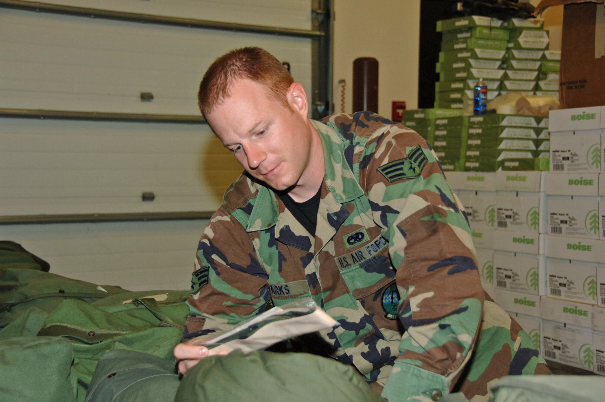 Senior Airman Neil Parks, 931st Air Maintenance Squadron, inspects the contents of his mobility bag in preparation for his deployment to Turkey. The first rotation of AMXS deployers are currently serving in Turkey in support of Operation Iraqi Freedom/Operation Enduring Freedom. (U.S. Air Force photo/Senior Airman Connor Burkhard)
