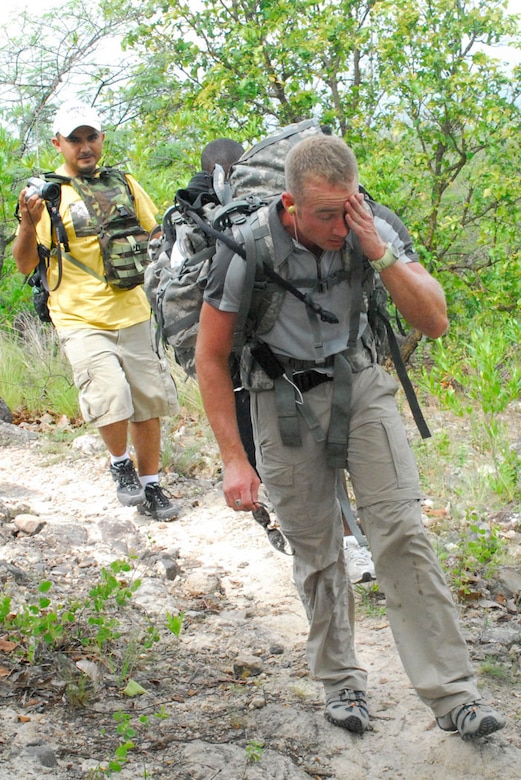 SOTO CANO AIR BASE, Honduras--A hiker wipes the sweat from his brow June 28 during the monthly chapel hike which delivers food and goods to people living in remote mountain Honduran villages.  The June chapel hike had hikers hauling goods to the tiny village of Picacho, Honduras, which sits atop a mountain 3,800 feet above sea level. (U.S. Air Force photo by Tech. Sgt. William Farrow)