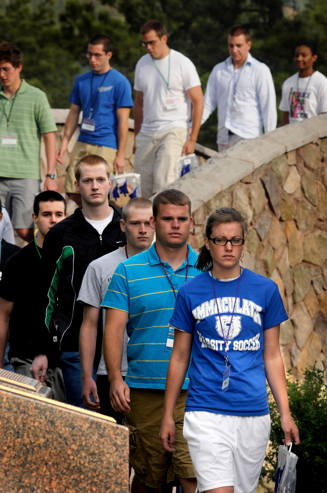 Members of the Class of 2012 cross the Heritage Bridge at Doolittle Hall before boarding buses that will take them to the base of the Core Values Ramp June 26 at the U.S. Air Force Academy, Colo. Inprocesing marks the start of 38 days of Basic Cadet Training, which is designed to prepare basic cadet trainees for entry into the cadet wing. (U.S. Air Force photo/Dennis Rogers)
