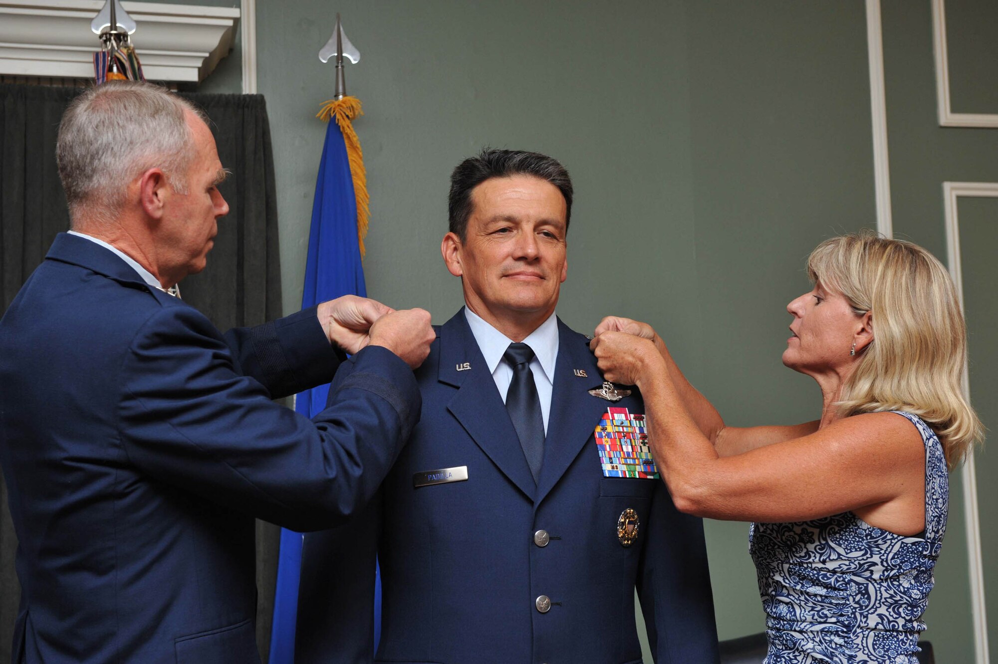 SHAW AIR FORCE BASE, S.C. -- Maj. Gen. Frank Padilla, Mobilization Assistant to the Commander, 9th Air Force and U.S. Air Forces Central, receives his second star from his wife, Vickie, and Maj. Gen. William Holland, Vice Commander, 9th AF and Deputy Commander, USAFCENT, during his promotion ceremony to Major General June 30 at the Carolina Skies Club. (U.S. Air Force photo/Tech. Sgt. Josef Cole)