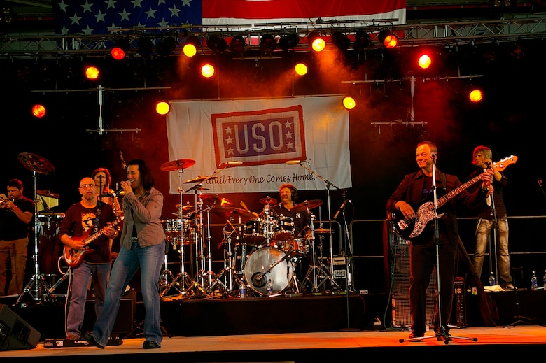 The Lt. Dan Band, named after Actor Gary Sinise's character in "Forrest Gump", played in Hangar 539 at RAF Mildenhall June 29. Mr. Sinise plays bass guitar in the band which was here as part of a United Services Organization tour, playing to servicemembers around the world to show their support for them. Approximately 650 people watched the concert as the Lt. Dan Band interacted with the crowd and kept everyone entertained for the two-hour show. (U.S. Air Force photo by Karen Abeyasekere)