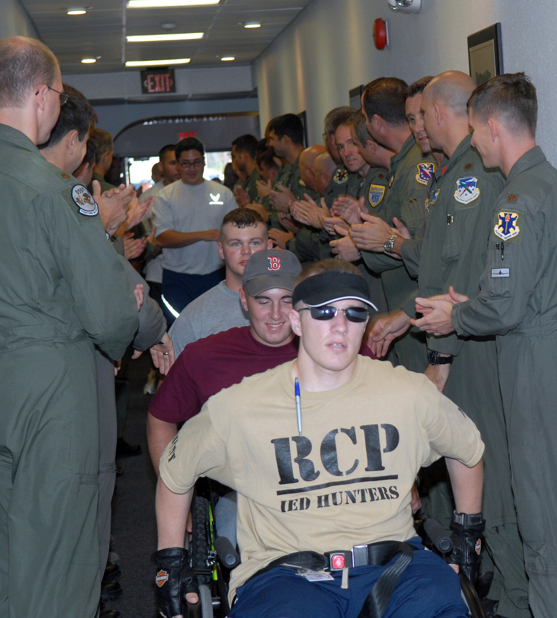 Nate Hunt enters the 559th Flying Training Squadron June 27 at Randolph Air Force Base, Texas. He and 12 other wounded warfighters recovering from serious injuries toured the base and flew a simulator at the 559th Flying Training Squadron. The wounded warriors are currently receiving care at the Center for the Intrepid at Brooke Army Medical Center in San Antonio. (U.S. Air Force photo/Rich McFadden) 

