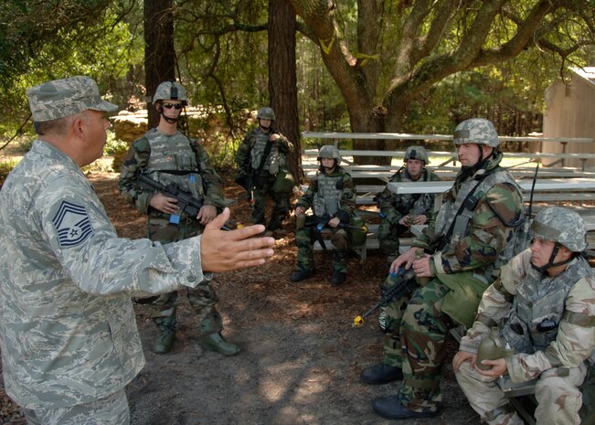 Chief Master Sgt. Lawrence Savidge debriefs security forces Airmen after completing a portion of the mobility exercise June 24 on Charleston AFB. Airmen from across the base are participating in a mobility exercise in preparation for the Headquarters Air Mobility Command operational readiness inspection in August. Chief Savidge is the SFS Manager and is also an Exercise Evaluation Team member during the exercises for the 437th Security Forces Squadron. (U.S. Air Force photo/Airman 1st Class Timothy Taylor)