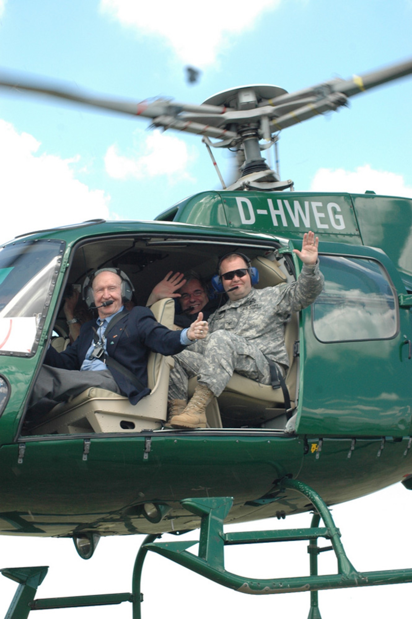 Retired Col. Gail Halvorsen, left, and Col. Ray Graham, commander of U.S. Army Garrison Wiesbaden, Germany, take off to drop candy during an open house celebrating the 60th anniversary of the Berlin Airlift at Wiesbaden Army Airfield June 29, 2008. (Photo by Kelli Bland)