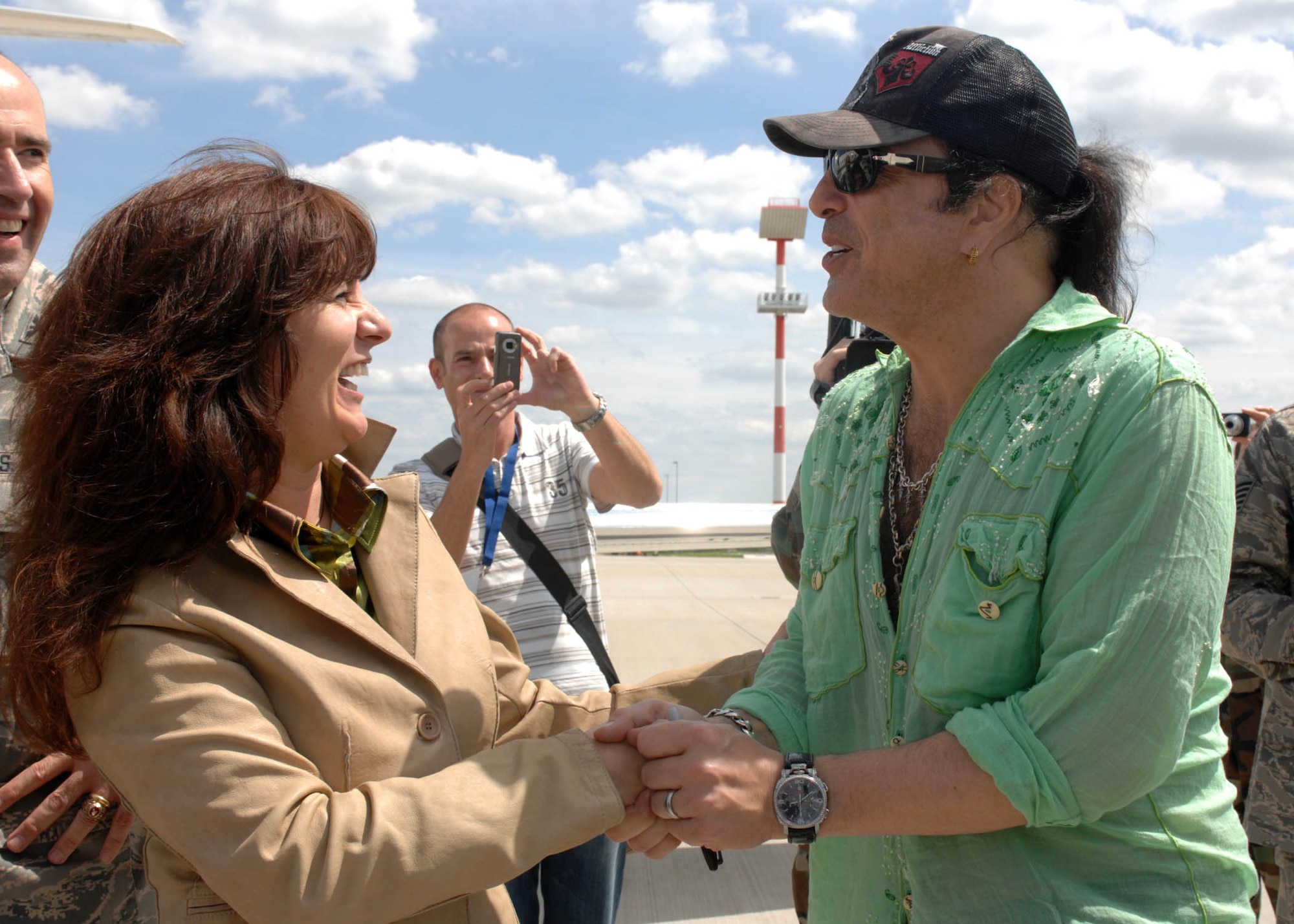 SPANGDAHLEM AIR BASE, Germany -- Mara Wight, wife of 52nd Fighter Wing commander Col. Lee Wight, greets Kiss lead vocalist and rhythm guitarist Paul Stanley as they exit their jet June 26, 2008. (U.S. Air Force photo by Airman 1st Class Jenifer Calhoun)