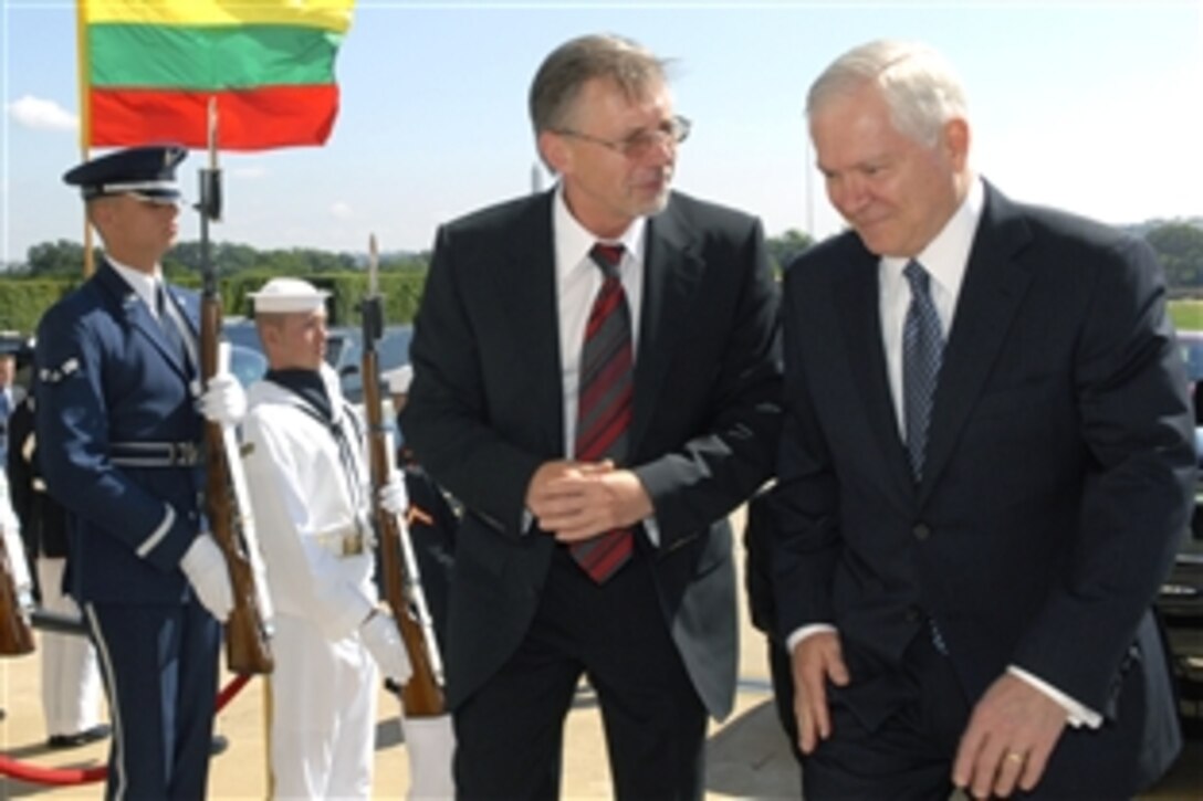 U.S. Defense Secretary Robert M. Gates, right, escorts Lithuanian Prime Minister Gediminas Kirkilas through an honor cordon into the Pentagon to conduct a closed-door discussion of bilateral issues, July 1, 2008.  