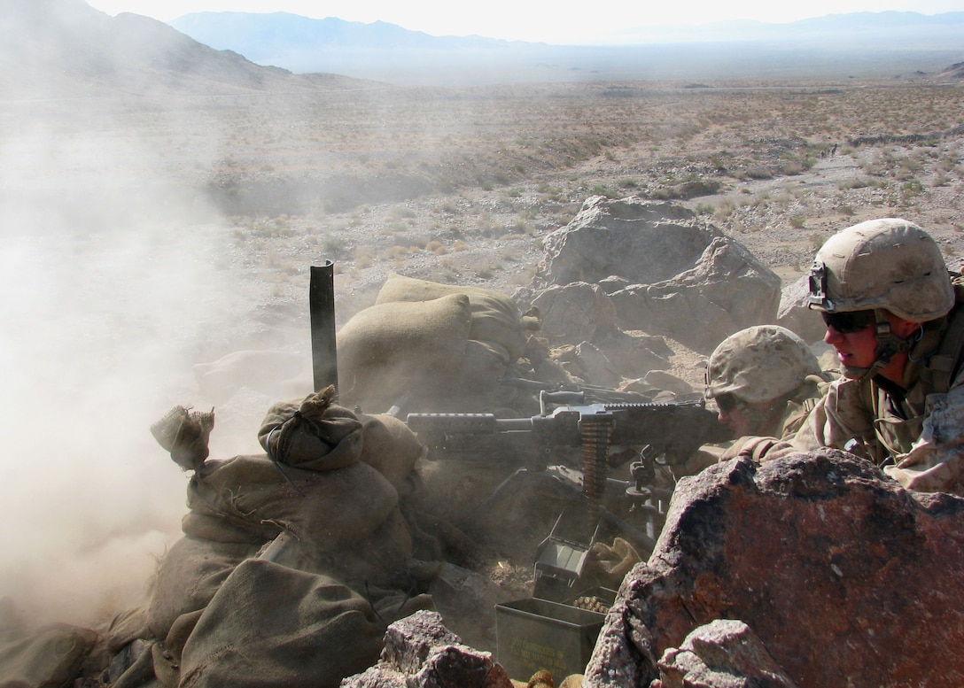 Lance Cpl. Francis Grenham and Cpl. Keith Anderson (right) employ their M240B machine gun in direct support of a platoon fire and maneuver attack during a live-fire training exercise at July 1, 2008 .  Grenham and Anderson are with Company E, 2nd Battalion, 25th Marine Regiment, a Marine Forces Reserve unit based in Harrisburg, Pa.  They are going through predeployment training here in preparation for deployment to Iraq in the fall.