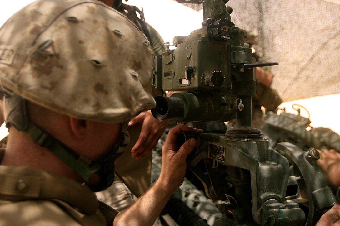 CAMP BUEHRING, Kuwait (July 3, 2008)--Pfc. Michael J. Schoepfer, a Marine with India Battery, Battalion Landing Team 2/5, 15th Marine Expeditionary Unit, sights in his M777 155mm Howitzer.::r::::n::Schoepfer, along with the rest of India Btry were conducting sustainment training on one of the many training ranges here.::r::::n::The Camp Pendleton, Calif., based 15th MEU is currently in Kuwait conducting sustainment training. (Official USMC photo by Staff Sgt. TG Kessler)(Released)::r::::n::
