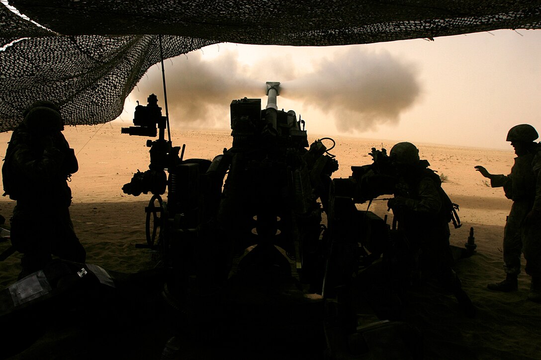 CAMP BUEHRING, Kuwait (July 3, 2008)--Marines from India Battery, Battalion Landing Team 2/5, 15th Marine Expeditionary Unit, fire their M777 Howitzer during a training range here.::n::Throughout their two-day training evolution, India Battery practiced the fundamentals of artillery firing roughly 100 rounds per gun in the six gun battery.::n::The 15th MEU is currently in Kuwait conducting sustainment training. (Official USMC Photo by Staff Sgt. TG Kessler)