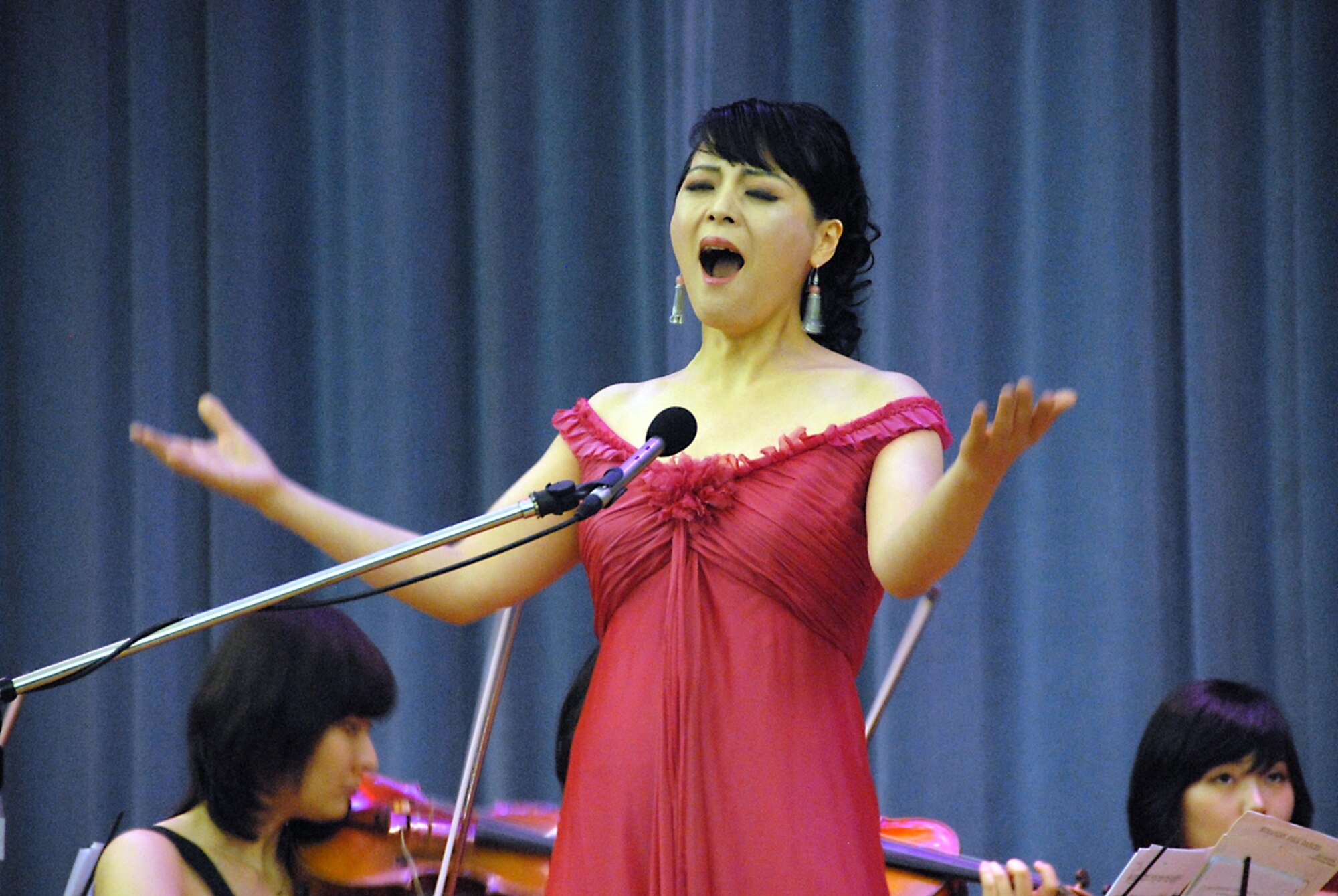 OSAN AIR BASE, Republic of Korea -- A member of the Seoul Classical Players performs for USAF and ROKAF members during the ROK-U.S. Good Will Concert at the base theatre July 1. The concert was sponsored by the Ministry of National Defense’s Arts Council Korea. (U.S. Air Force photo/Senior Master Sgt. Marvin Krause)