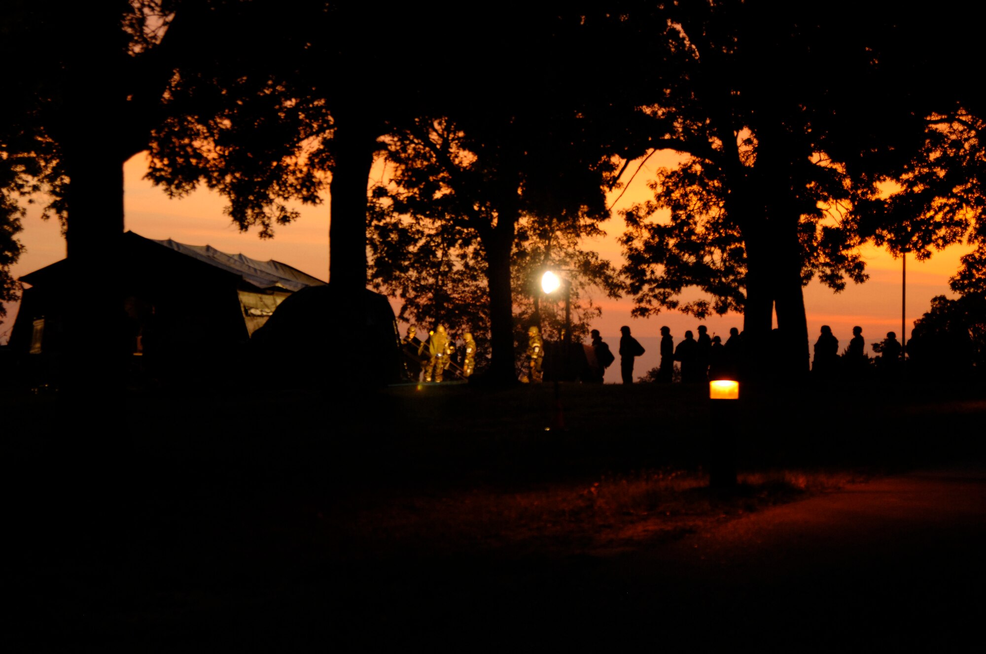 VOLK FIELD AIR NATIONAL GUARD BASE, Wis. -- Airmen of the 804th Air Expeditionary Wing, wait in line in the early morning for breakfast at Volk Field, Wis., June 27. The main dining facility kitchen closed due to exercise requirements and moved to a large tent outside where airmen waited for their first hot meal of the day.(photo by Senior Airman Laura Suttles)
