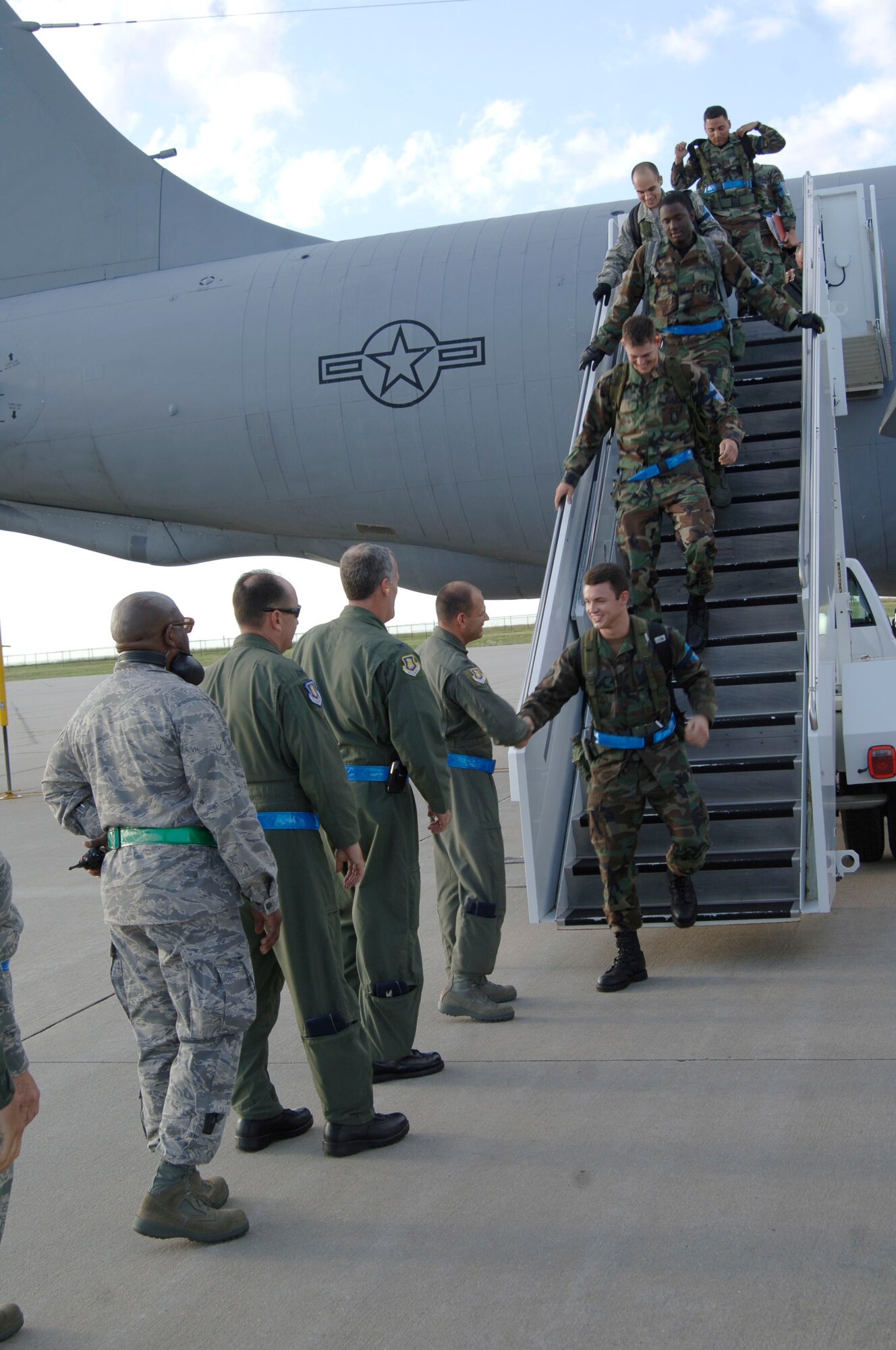 MCCONNELL AIR FORCE BASE, Kan. -- Team McConnell members are greeted by senior leaders, after coming off a KC-135 Stratotanker on the flight line, June 28 after returning from an Operational Readiness Inspection. To prepare for the ORI, Team McConnell trained for contingency operations for the past five months. (Photo by Senior Airman Roy Lynch III)