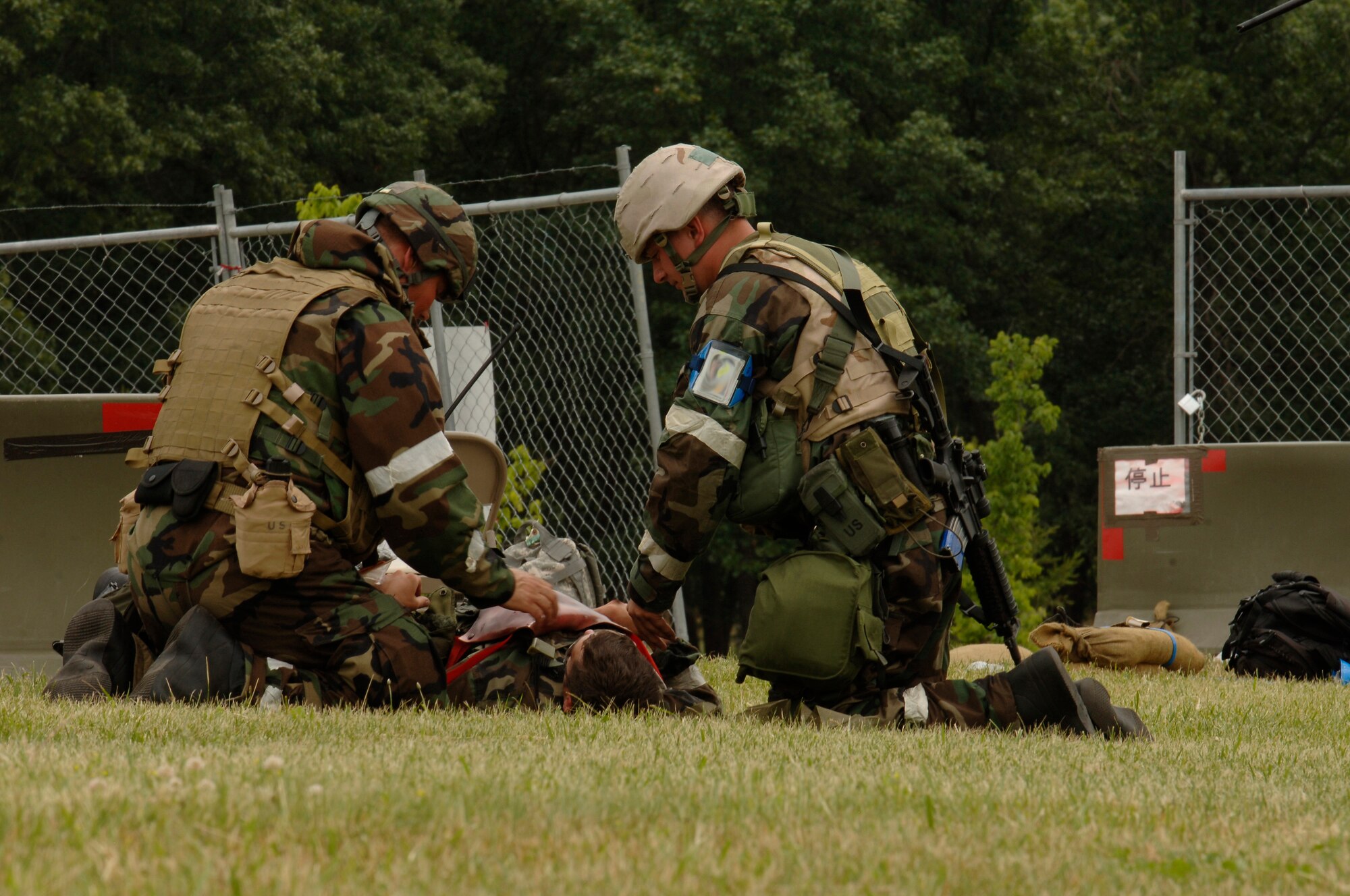 VOLK FIELD AIR NATIONAL GUARD BASE, Wis. -- Senior Airman Thomas Murray, 804th Security Forces Squadron, recieves self-aid and buddy care from his fellow wingmen at Volk Field, Wis., June 27. Airmen perform self-aid and buddy care on other airmen when they run into medical situations such as unconciousness, broken bones, and open wounds. (photo by Senior Airman Laura Suttles)