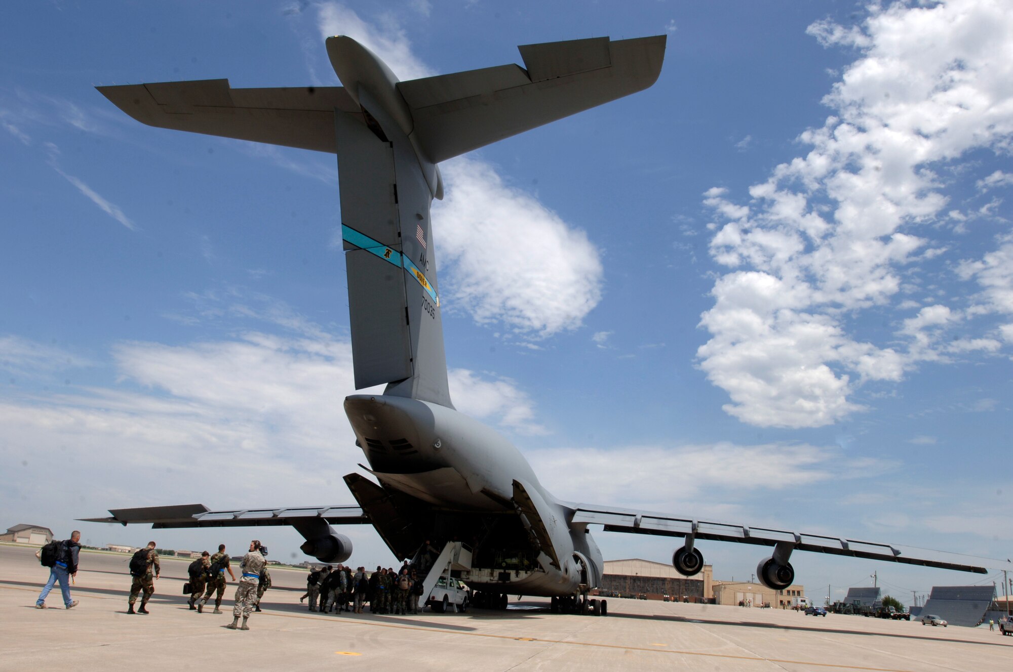 MCCONNELL AIR FORCE BASE, Kan. -- The ADVON team boards a C-5 Galaxy in preparation for an Operational Readiness Inspection, Jun 23. The ADVON team was the first team to depart for Volk Field, Wis. and contained members from wing leadership as well as multiple Airmen from other agencies. (Photo by Airman Justin Shelton)
