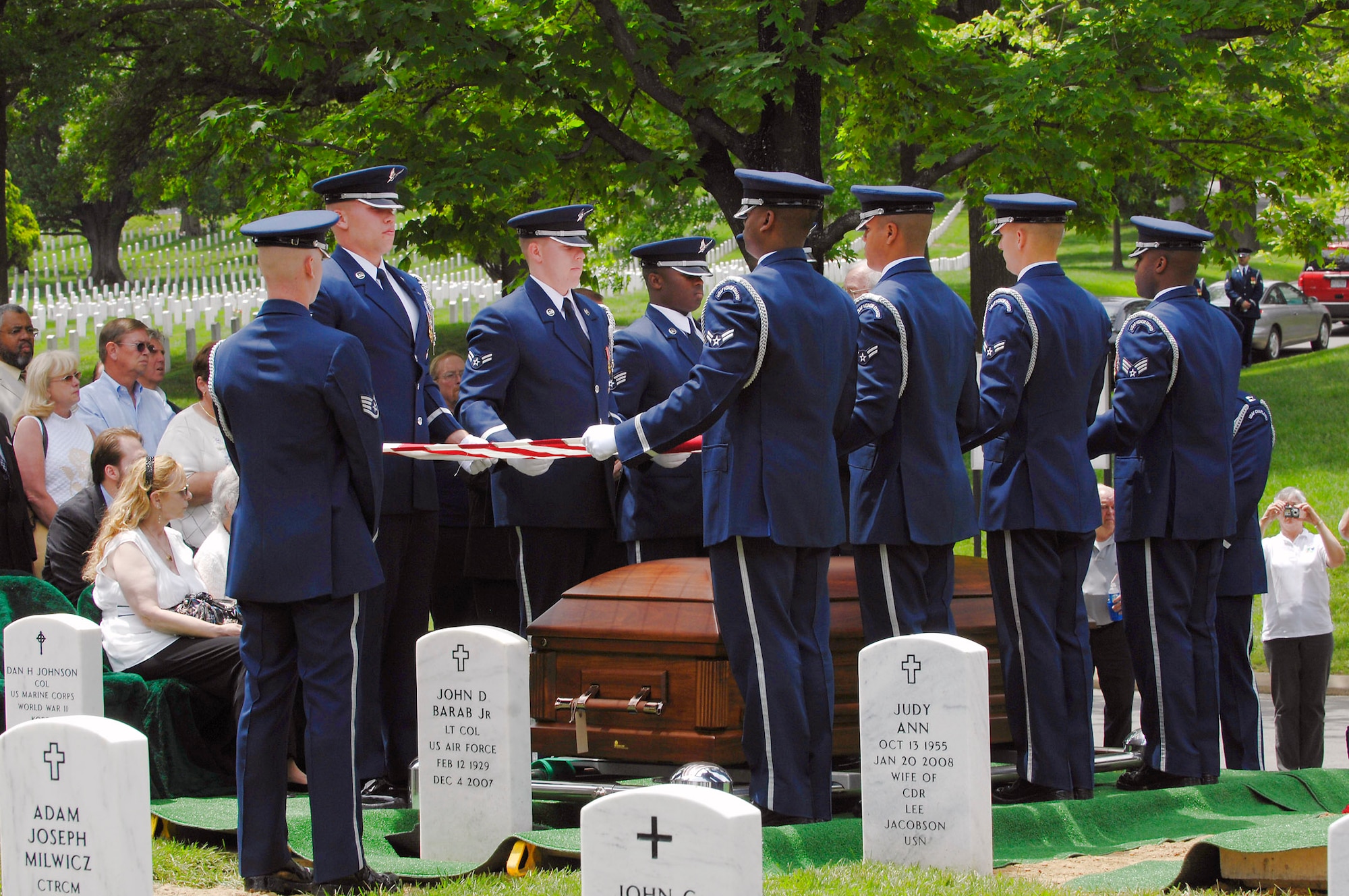 An Air Force honor guard folds the American flag over the casket of Senior Master Sgt. James Caniford who was buried May 28 in Arlington National Cemetery in Virginia. Sergeant Caniford, who was missing in action from the Vietnam War and from the 16th Special Operations Squadron, was recently identified. (U.S. Air Force photo/Senior Airman Marleah Miller) 

