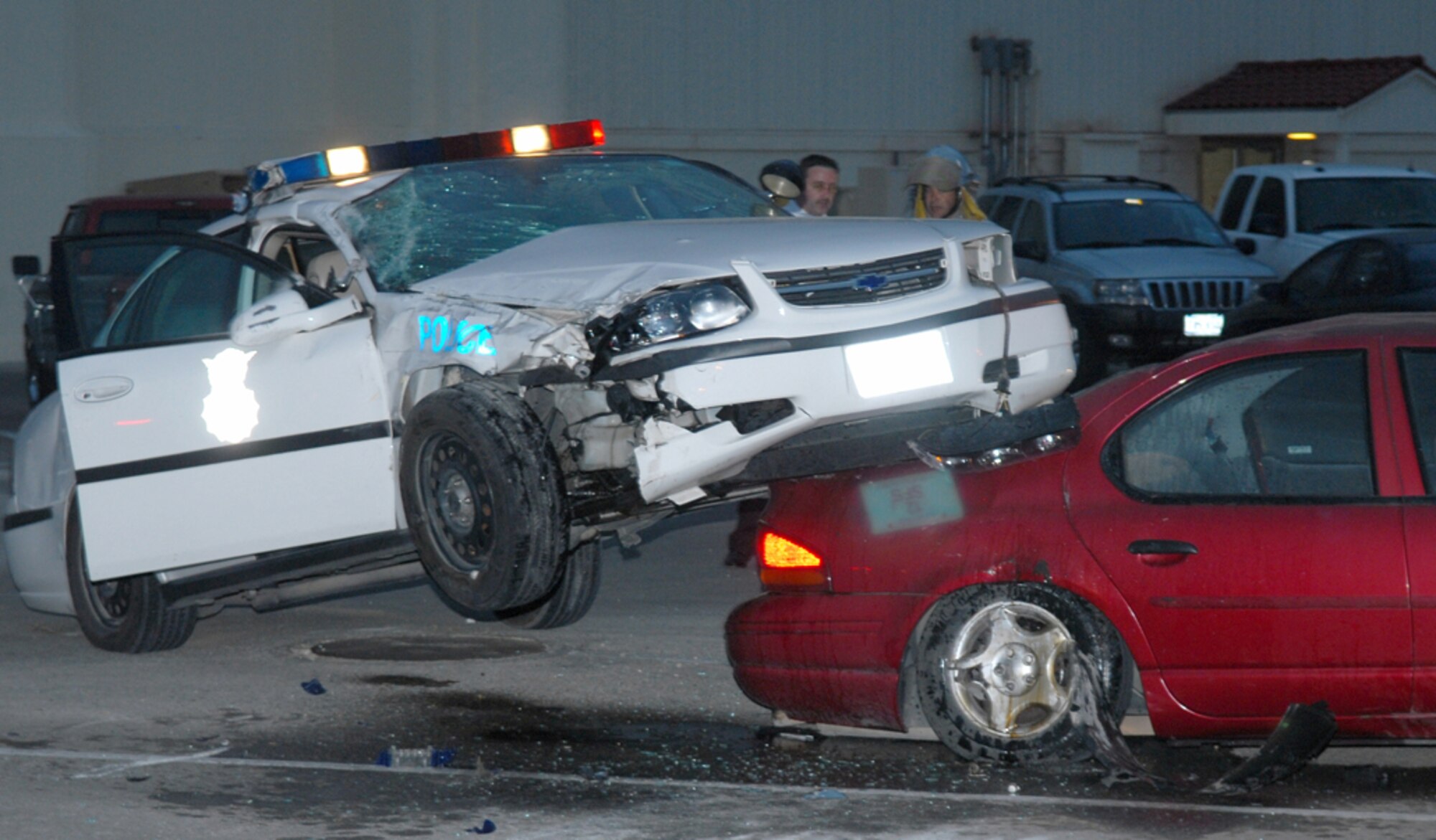 After doing a complete flip in the air, a patrol car at Randolph Air Force Base, Texas, landed on another vehicle, which, ironically, was parked in front of the wing safety office. (photo by Rich McFadden)