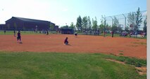 MINOT AIR FORCE BASE, N.D. -- Children, ages seven to nine, play a baseball game July 1 at “field one” as part of the summer youth baseball program at the David C. Jones Youth Center here. Baseball is one way Minot AFB kids stay busy during the summer months. It is also a great opportunity for parents to encourage their kids to participate in outdoor activities and stay active. (U.S. Air Force Photo by Airman 1st Class Benjamin Stratton)