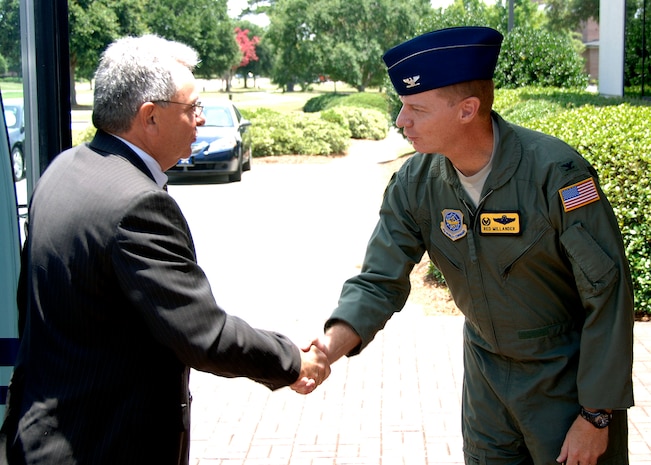 Col. John "Red" Millander greets Jean-Robert Cazarre at the wing headquarters building July 1 as part of a European Organization for the Safety of Air Navigation visit. The purpose of Mr. Cazarre's visit was to observe how the Charleston community integrates its military and civilian airport and airfield management operations to benefit both operations. Colonel Millander is the 437th Airlift Wing commander and Mr. Cazarre is the director for the directorate of Civil and Military Air Traffic Management for EUROCONTROL. (U.S. Air Force photo/Airman 1st Class Timothy Taylor)