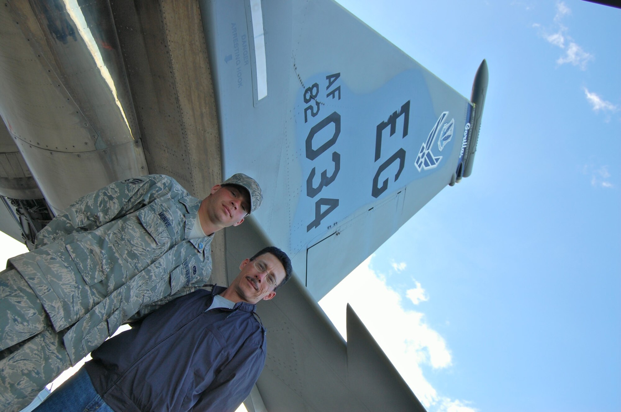 Senior Airman Mario Munive, a crew chief with the 58th Fighter Squadron at Eglin Air Force Base, Fla., stands with his uncle, Rick Munive, who traveled 14 hours by bus to see his nephew for the first time in six years.  Senior Airman Munive participated in the RIO NEGRO air and trade show assisting the F-15 West Coast Demonstration Team. (U.S. Air Force photo by Capt. Nathan D. Broshear)