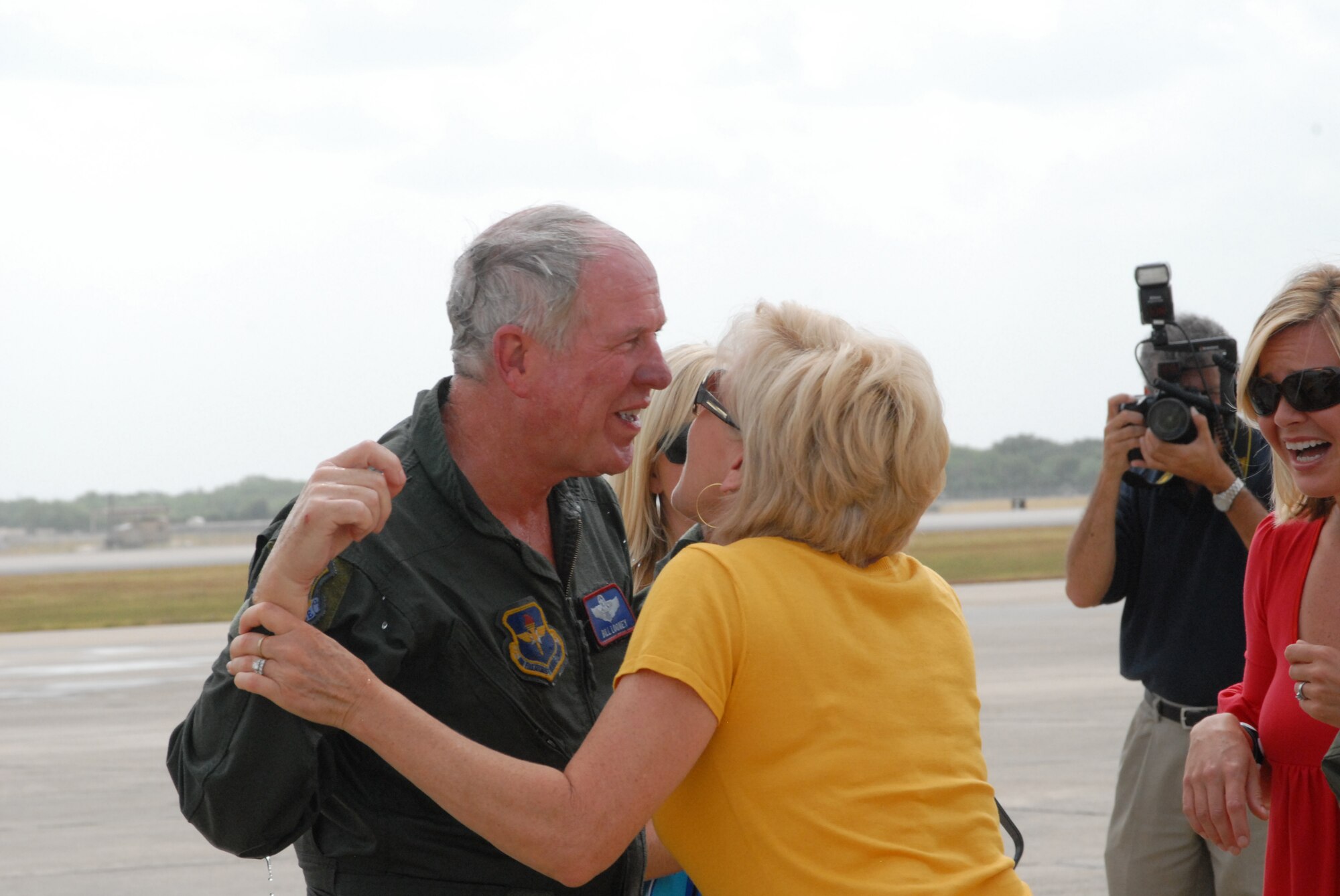 Gen. William R. Looney, Commander, Air Education and Training Command, was honored by fellow Airmen, friends and family during his final, or "fini," flight July 1. General Looney selected an F-15 aircraft as his last flight and was honored by firefighters dousing him with hundreds of gallons of water and friends and family showering him with warm wishes for his retirement. (U.S. Air Force photo by Rich McFadden)