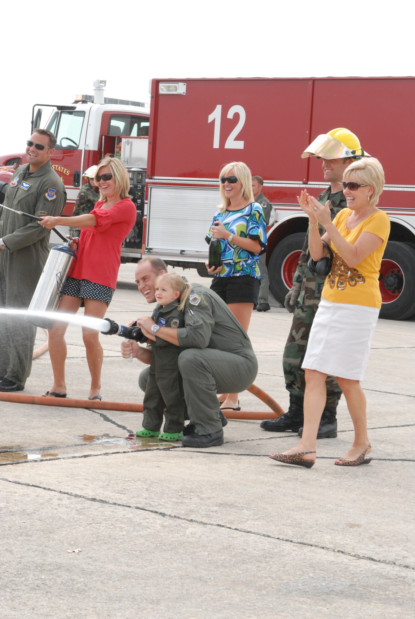 Gen. William R. Looney, Commander, Air Education and Training Command, was honored by fellow Airmen, friends and family during his final, or "fini," flight July 1. General Looney selected an F-15 aircraft as his last flight and was honored by firefighters dousing him with hundreds of gallons of water and friends and family showering him with warm wishes for his retirement. (U.S. Air Force photo by Rich McFadden)