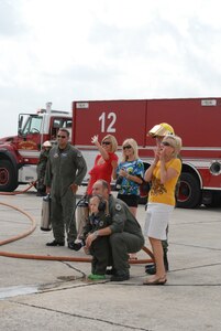 Gen. William R. Looney, Commander, Air Education and Training Command, was honored by fellow Airmen, friends and family during his final, or "fini," flight July 1. General Looney selected an F-15 aircraft as his last flight and was honored by firefighters dousing him with hundreds of gallons of water and friends and family showering him with warm wishes for his retirement. (U.S. Air Force photo by Rich McFadden)