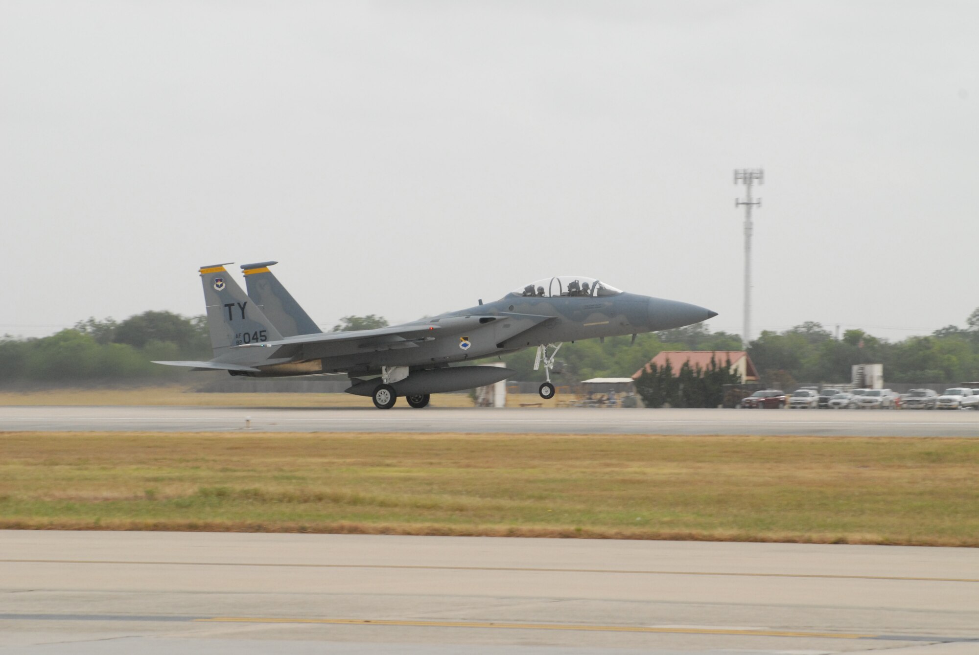 Gen. William R. Looney, Commander, Air Education and Training Command, was honored by fellow Airmen, friends and family during his final, or "fini," flight July 1. General Looney selected an F-15 aircraft as his last flight and was honored by firefighters dousing him with hundreds of gallons of water and friends and family showering him with warm wishes for his retirement. (U.S. Air Force photo by Rich McFadden)