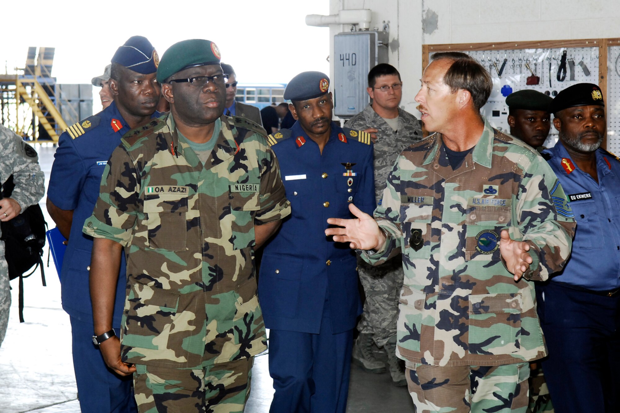 General Owoye Azazi, Chief of Defense Staff in Nigeria, and his staff get a tour of the Corrosion Control Facility from Master Sgt. Robert Miller, 43rd Maintenance Squadron, June 26. General Azazi visited Pope and neighboring Fort Bragg as part of a tour of the United States.  (U.S. Air Force Photo by Mike Murchison)