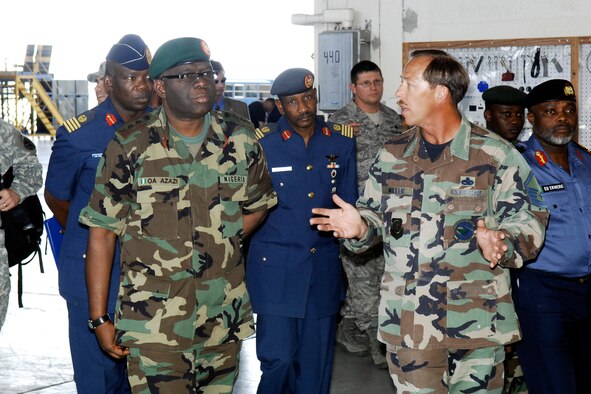 General Owoye Azazi, Chief of Defense Staff in Nigeria, and his staff get a tour of the Corrosion Control Facility from Master Sgt. Robert Miller, 43rd Maintenance Squadron, June 26. General Azazi visited Pope and neighboring Fort Bragg as part of a tour of the United States.  (U.S. Air Force Photo by Mike Murchison)