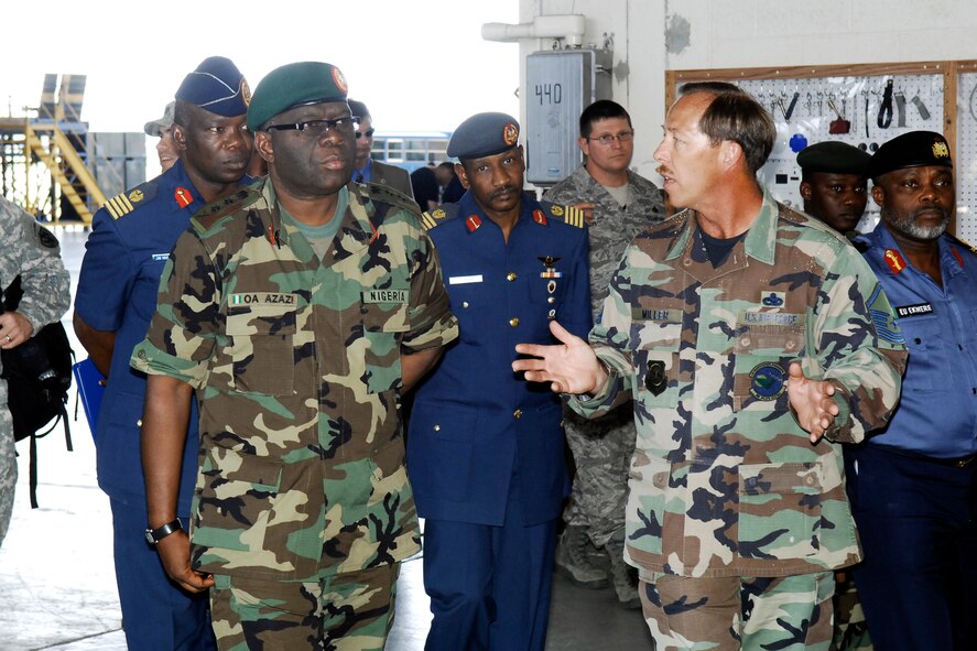 General Owoye Azazi, Chief of Defense Staff in Nigeria, and his staff get a tour of the Corrosion Control Facility from Master Sgt. Robert Miller, 43rd Maintenance Squadron, June 26. General Azazi visited Pope and neighboring Fort Bragg as part of a tour of the United States.  (U.S. Air Force Photo by Mike Murchison)