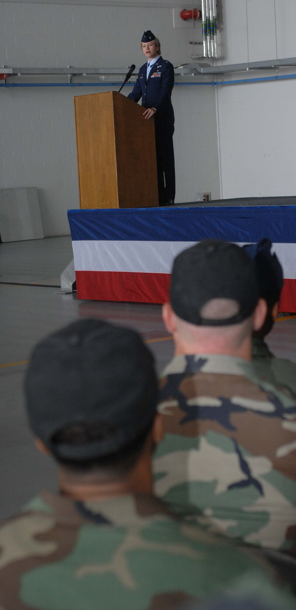 Lt. Col. Ginger Wallace addresses the members of the 488th Intelligence Squadron July 2 during a change of command ceremony.  Lt. Col. Wallace, who joins Team Mildenhall from Air Force Personnel Center at Randolph Air Force Base, Texas, is assuming command from Lt. Col. Patrick Flood.  (U.S. Air Force photo by Amn Brad Smith)