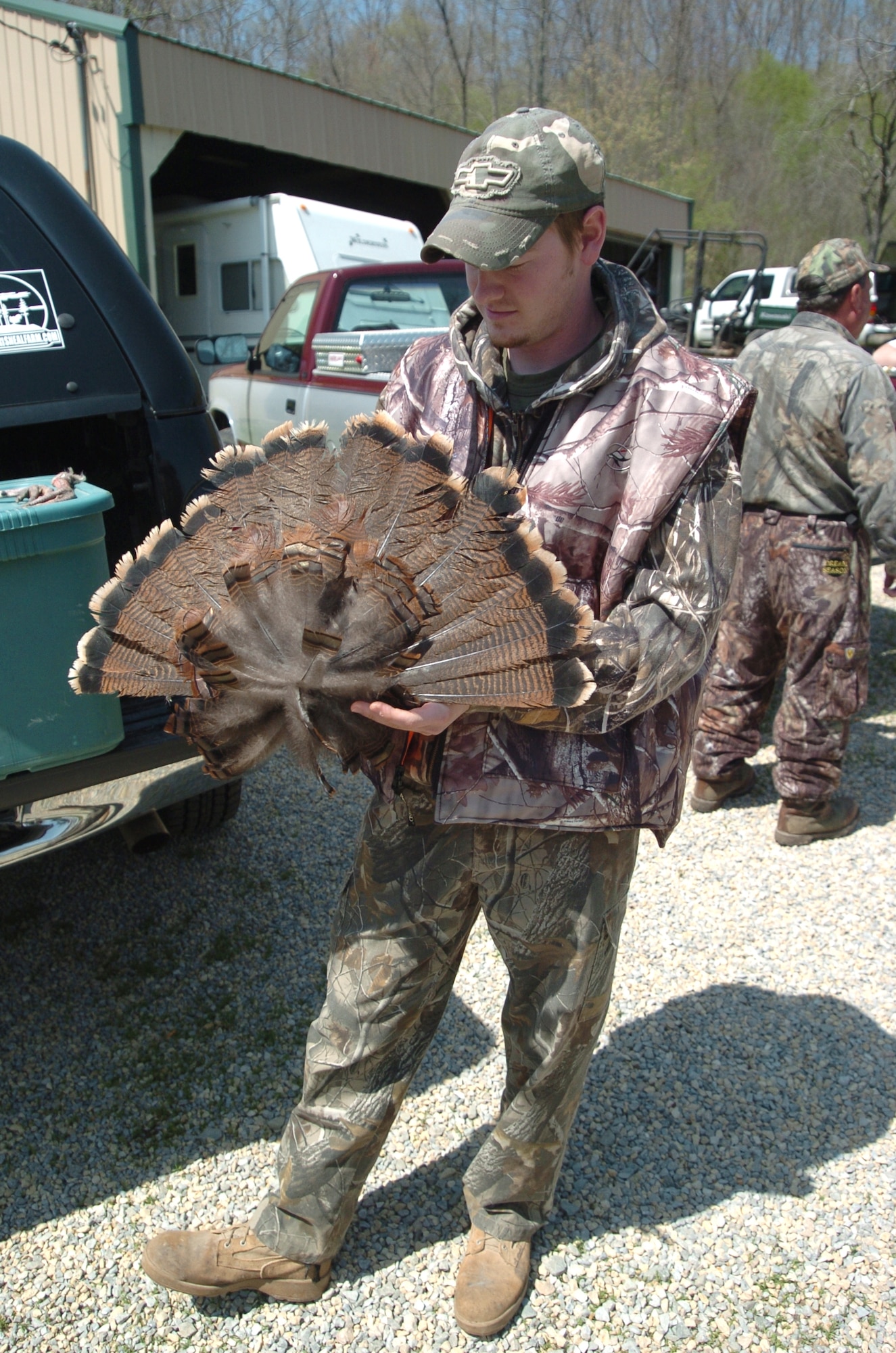 SCOTT AIR FORCE BASE, Ill. --Jared Feldman, a former Army sergeant wounded in Iraq, spreads a fan of tail feathers from a turkey he killed at Camp Hope during the April turkey hunt.
Cortesy photo