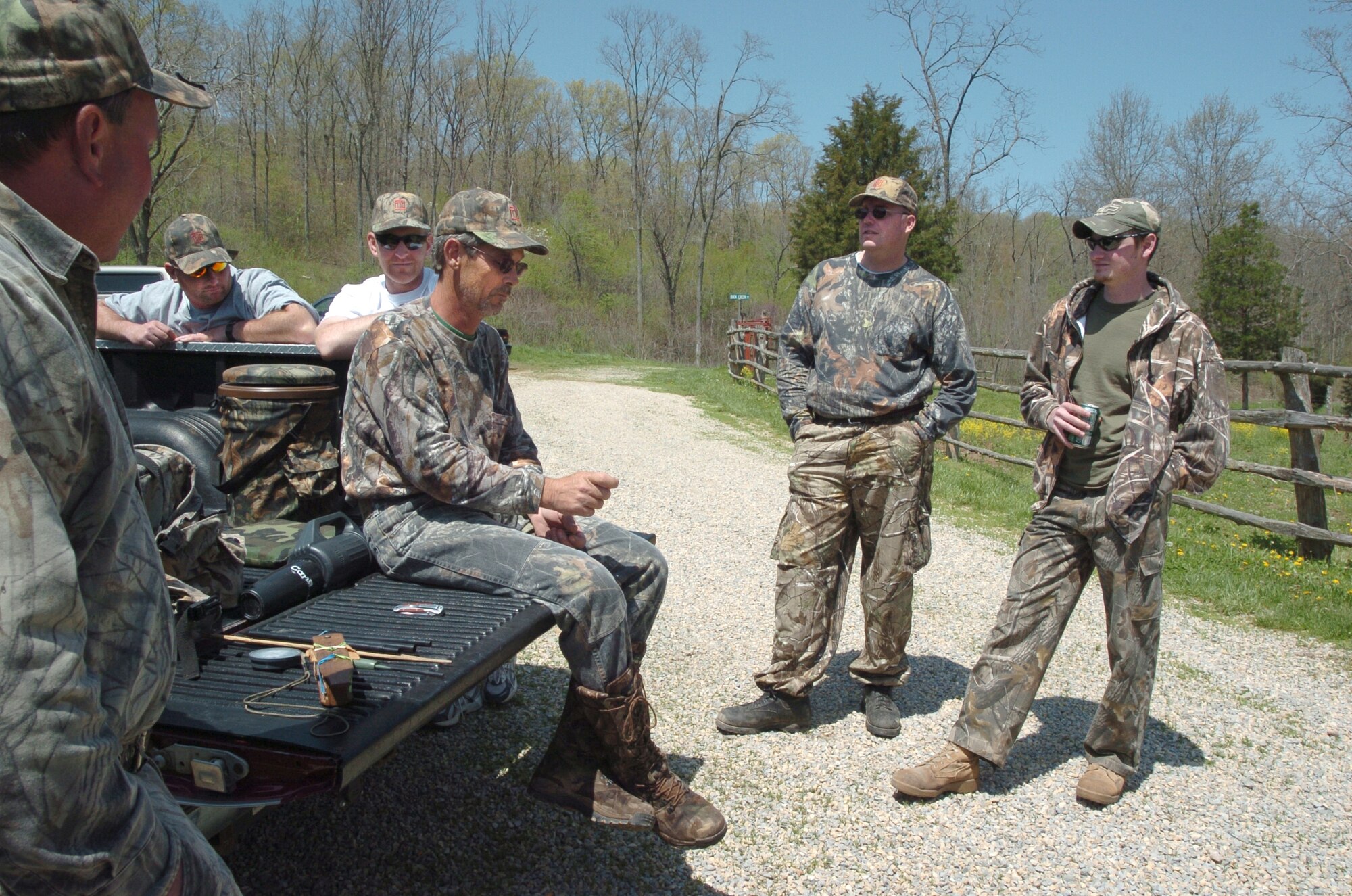 SCOTT AIR FORCE BASE, Ill. -- Mike White (seated) swaps stories with fellow hunters and veterans at Camp Hope during the fall turkey hunt. 
Cortesy photo