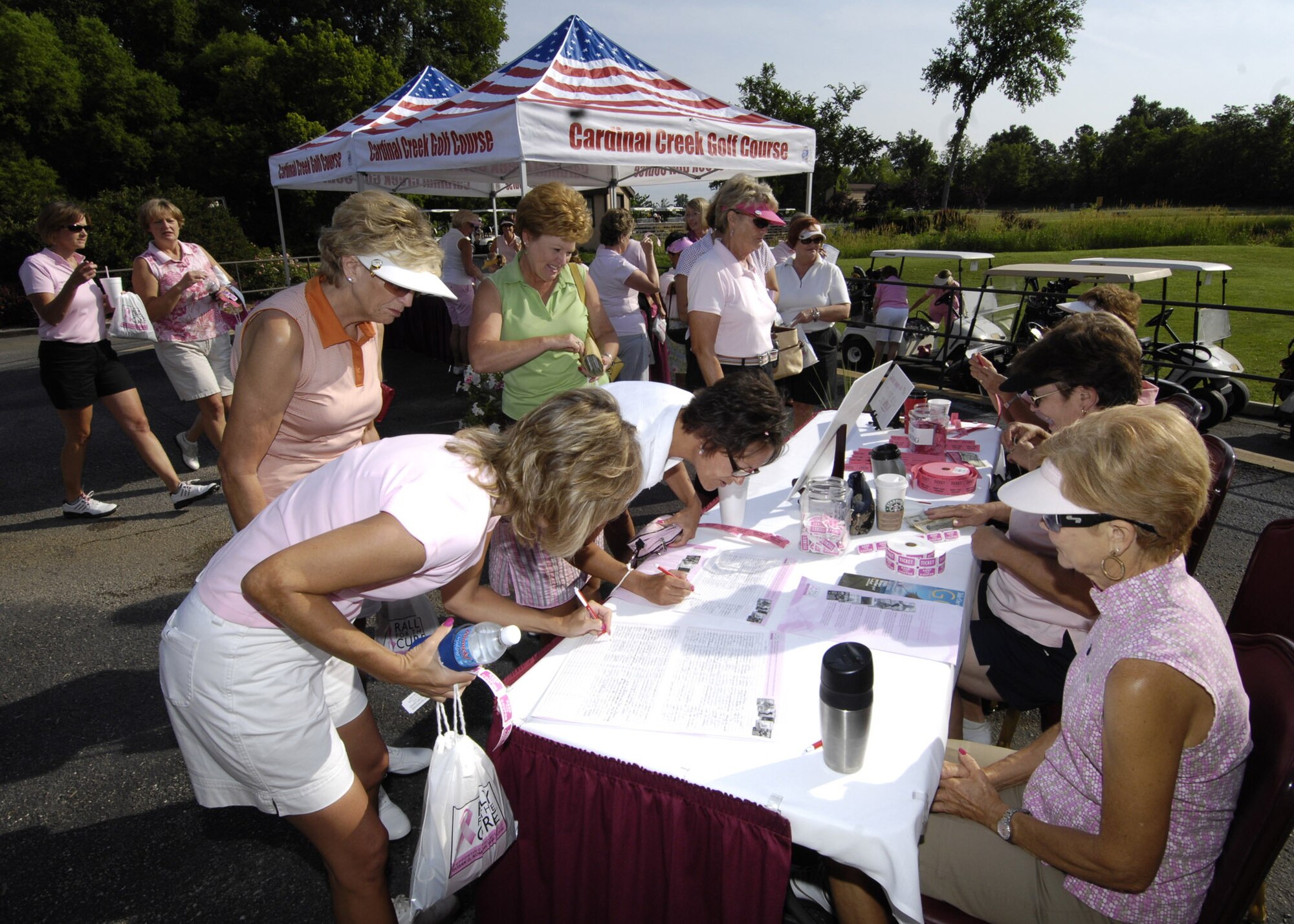 SCOTT AIR FORCE BASE, Ill. -- Deanie Nichols signs in golfers at Cardinal Creek. Many women gathered at Cardinal Creek Course to raise money for the Rally for the Cure. 
(US Air Force photo/Senior Airman Mildred Guevara)