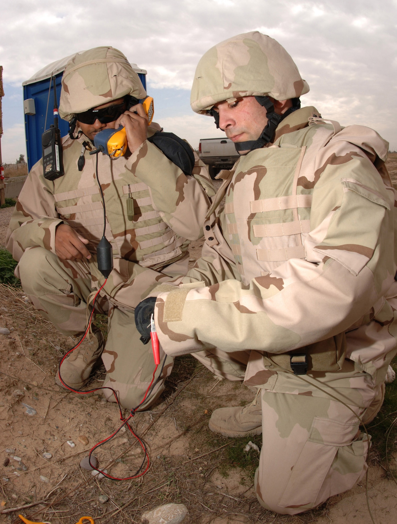 Communications and Information specialists like Senior Airman Kenneth Hawkins and Airman 1st Class Ryan Gall, seen here testing cutfield wires for a dial tone in Iraq, will soon see changes to their job requirements as the Air Force proposes 15 new cyberspace career fields. These voice systems technicians are just two of the approximately 30,000 active-duty members who'll be affected by the changes. (U.S. Air Force photo/Senior Airman Bradley A. Lail)