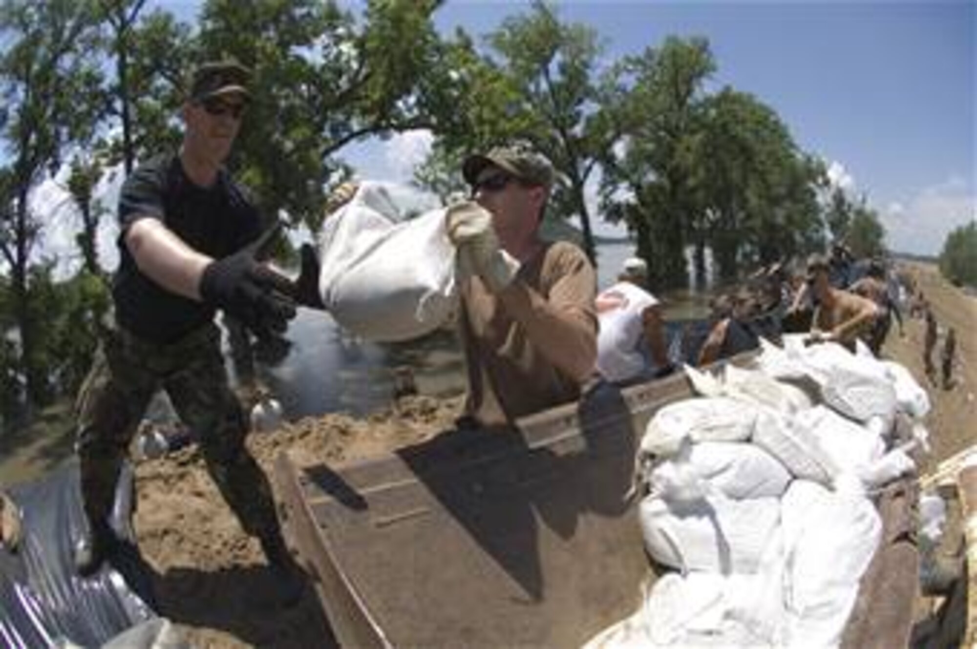 SCOTT AIR FORCE BASE, Ill. -- Approximately 400 Air National Guardsman from Scott and Illinois National Guardsman aid in flood relief efforts effecting Illinois as well as most of the Mid-west.  Several levees have broken causing flooding to many homes and businesses. Relief efforts included making sandbags. 
Courtesy photo